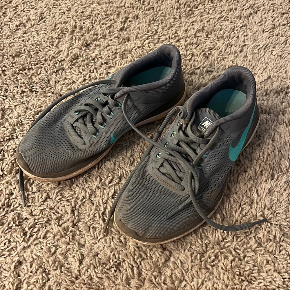 Grey and teal Nike runners